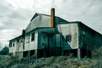 Fotobehang spooky haunted abandoned factory warehouse scary foreboding dangerous building © DrewTraveler