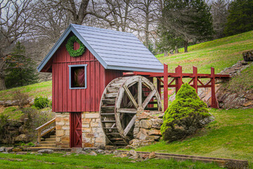 vintage hillside waterwheel turbine red wooden hunt mountain stream raised water shed