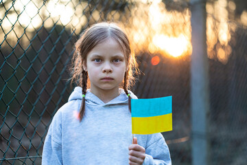 Portrait of little girl against sunset