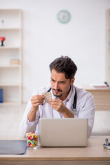 Young male doctor working in the clinic