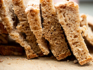 Close up of homemade bread slices. It is so fresh that the room is filled with the scent of freshly baked bread. 
