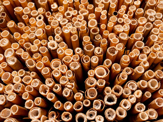 The ends of a bamboo mat form an abstract pattern. 
