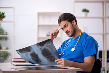 Young male doctor radiologist working in the clinic
