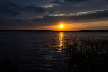 Fototapeta na wymiar Incredibly beautiful sunset on the lake. High quality photo