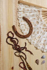 Fototapeta premium Horseshoe With Vintage Lace Fan Beads and Arrowheads