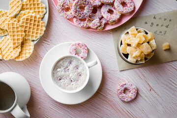 cup of fresh aromatic homemade hot chocolate or cacao served for breakfast at home on pink background