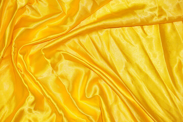 Yellow cloth background abstract with soft waves.