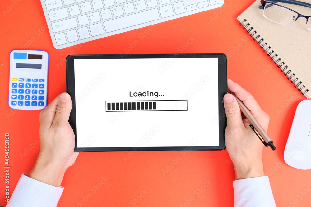 Poster hand used tablet with concept of improving website loading speed
