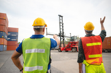 foreman team are working at container yard, logistic cargo warehouse for industrial shipping