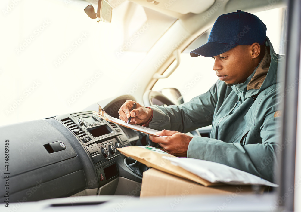 Aufkleber lets see where to next.... shot of a courier writing on a clipboard while sitting in a delivery van.