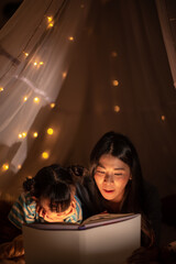 education learning concept with homework, young woman teaching to daughter at home