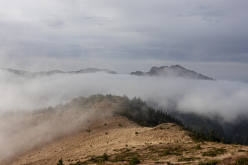 Fototapeta na wymiar Landscape with Mountain Peaks and Fog