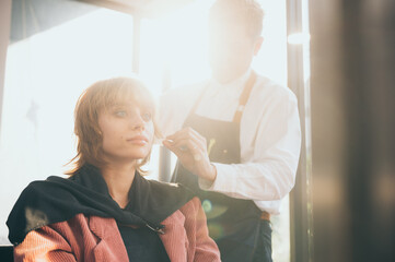 Obraz premium woman client person having a process to making treatment a hair with hairdresser in beauty salon