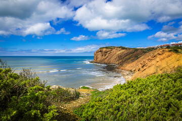 Beautifull cliffs over the sea at the beach of Sao Martinho do Porto - Portugal. Seascape view with cliffs at Portugal