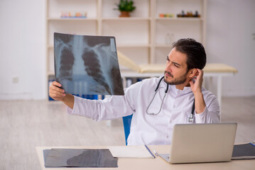 Young male doctor radiologist working in the clinic