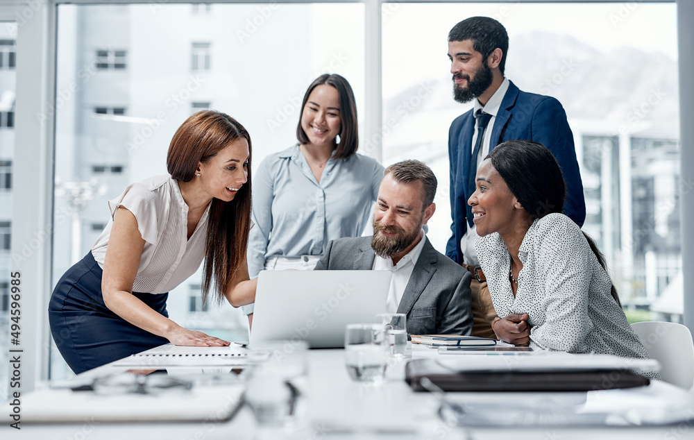 Aufkleber Working through different problem-solving approaches. Shot of a group of businesspeople working together on a laptop in an office.