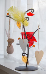 wooden easter bunny with polka dots and two wooden hearts