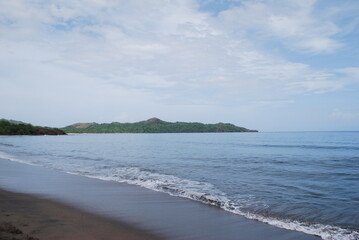 beach, sea, and jungle landscape