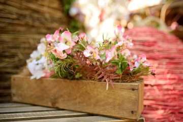 Easter decorations for outdoor celebrations. Traditions of the Easter holiday. Flowers in wooden boxes. Street Festival.