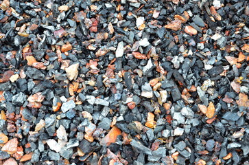 The graphic resource consists of a texture of incompletely burned coal.