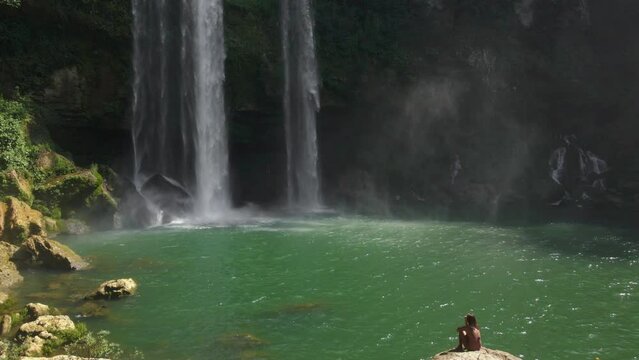 Female Tourist Enjoing the View of Misoh-Ha Waterfall in Chiapas, Mexico