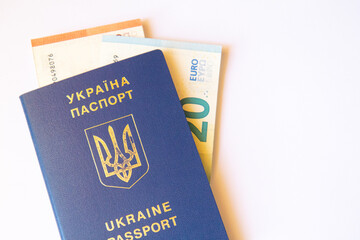 Ukrainian passport with euro on white background. Close up view. Copy space