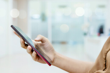 Close up hand of woman using mobile smartphone