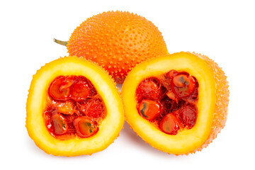 Fresh Gac Fruit or Baby Jackfruit, bright yellow fruit turn in orange in round shape with thorns and cut in half pieces, isolated on white background. Clipping path