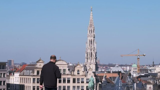 4K Tourist Taking Picture of the Brussels Town Hall Spire, Cityscape of Old European Capital in the Summer