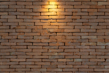 Brickwall backdrop with the tungsten lights from spotlight for Art Exhibition or vintage classic display product background.
