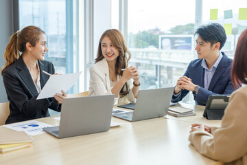 Entrepreneurs and business people conference in modern meeting room, happy multiracial coworkers have fun cooperating working together at office meeting, asian teamwork concept