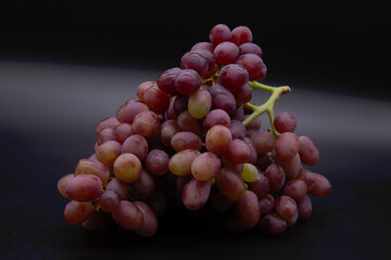 bunch of red grapes on black background. Include Clipping Path.