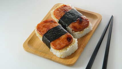 Musubi Consist of Packed Rice, Slice of meat, wrapped in nori