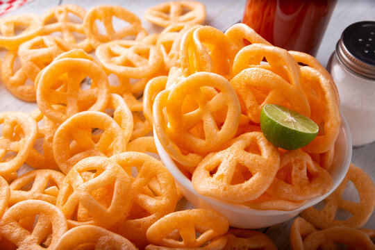 Chicharrones de Harina. Also known as duros, duritos, Mexican wagon wheels  or pinwheels, they are a very popular snack made from flour, commonly  accompanied with hot sauce and lemon juice. Stock-bilde