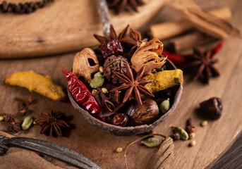 Various spices on wooden background