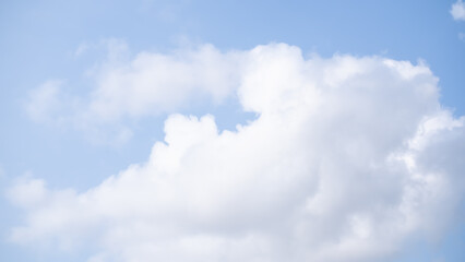 Obraz premium Blue sky white cloud background. sunlight day with sky wallpaper backdrop. mockup nature landscape free space backdrop. card or poster for environment protection.