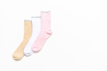 Various modern trendy women's cotton socks set on white background. Fashionable socks store. Socks shopping, sale, merchandise, advertisement concept. Flat lay, top view, copy space