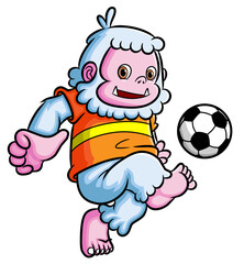The sporty yeti playing the football and kicking the ball