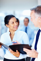 Junior executive discussing plans with CEO. Businessman and woman happy with proposal.