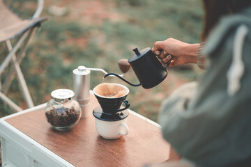 Happy woman relaxing in the holiday morning, traveling and slow life, resting style, camping. selective and soft focus.