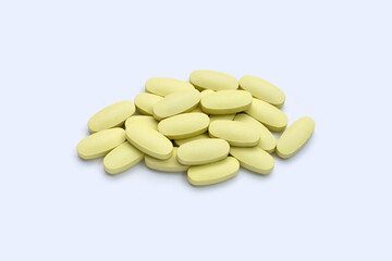 Vitamin c pills on white background.