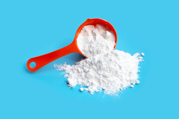 Baking soda on blue background.