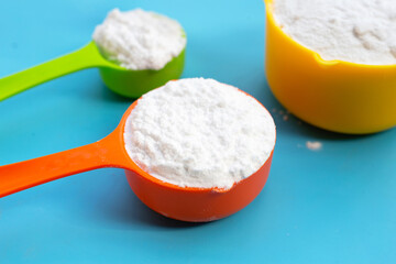 Baking soda on blue background.