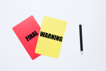 Red and yellow card written final warning with pencil on white background - obrazy, fototapety, plakaty