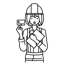 立って書類とカードを手に持つ工事現場の女性