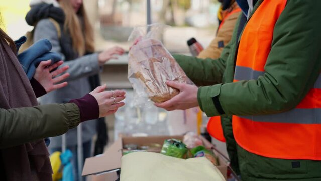 Volunteers distributing blankets and other donations to refugees on the Ukrainian border.