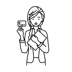 立って書類とカードを手に持つジャケットの女性