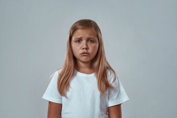 Fototapeta premium Partial image of sad little girl looking at camera