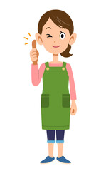 サムアップするエプロンを着用した女性
