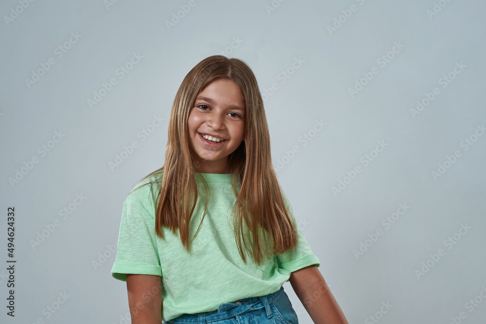 Wall mural cropped image of girl posing and looking at camera